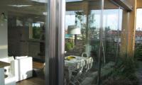 Veranda eseguita con profili Forster in acciaio inox satinato